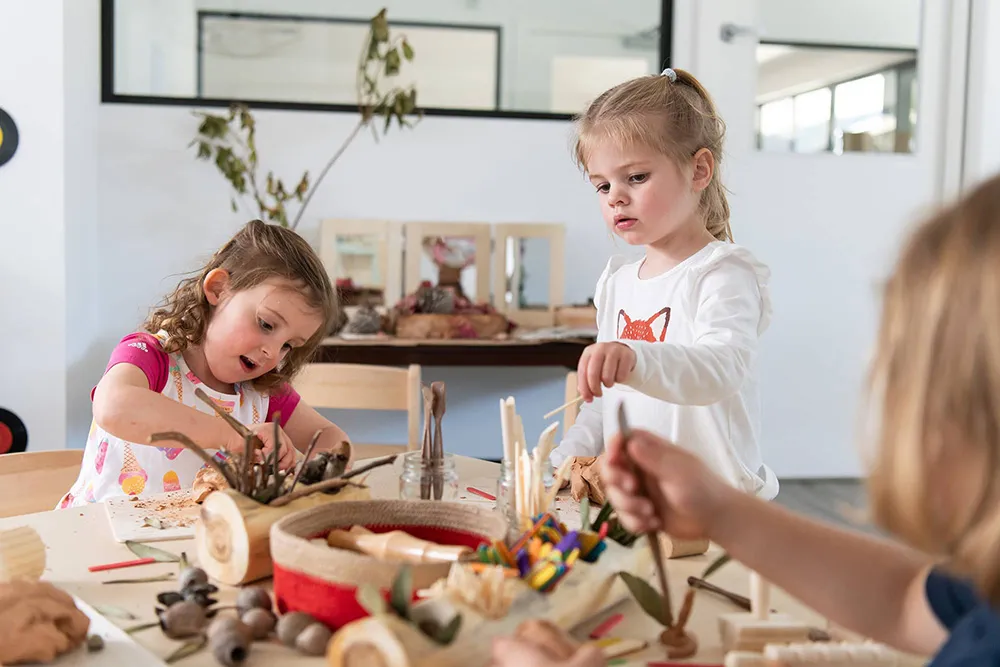 Children learning with natural materials in a Beyond Early Learning centre.