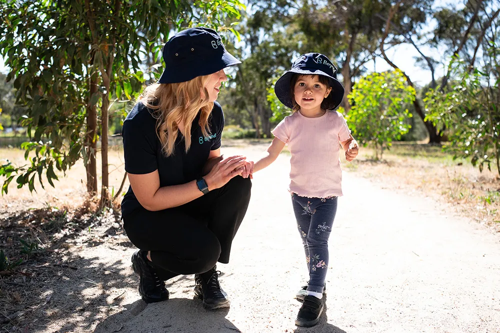 A child being cared for by an early childhood educator at Beyond.