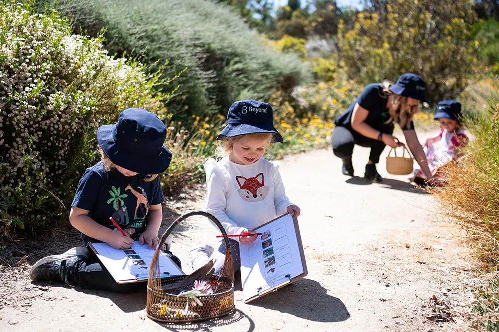 Children outdoors enjoying a natural learning program at Beyond Early Learning.
