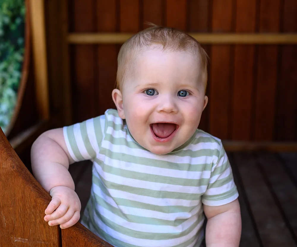 Healthy happy young toddler with positive wellbeing in an outdoor environment at Beyond Early Learning.