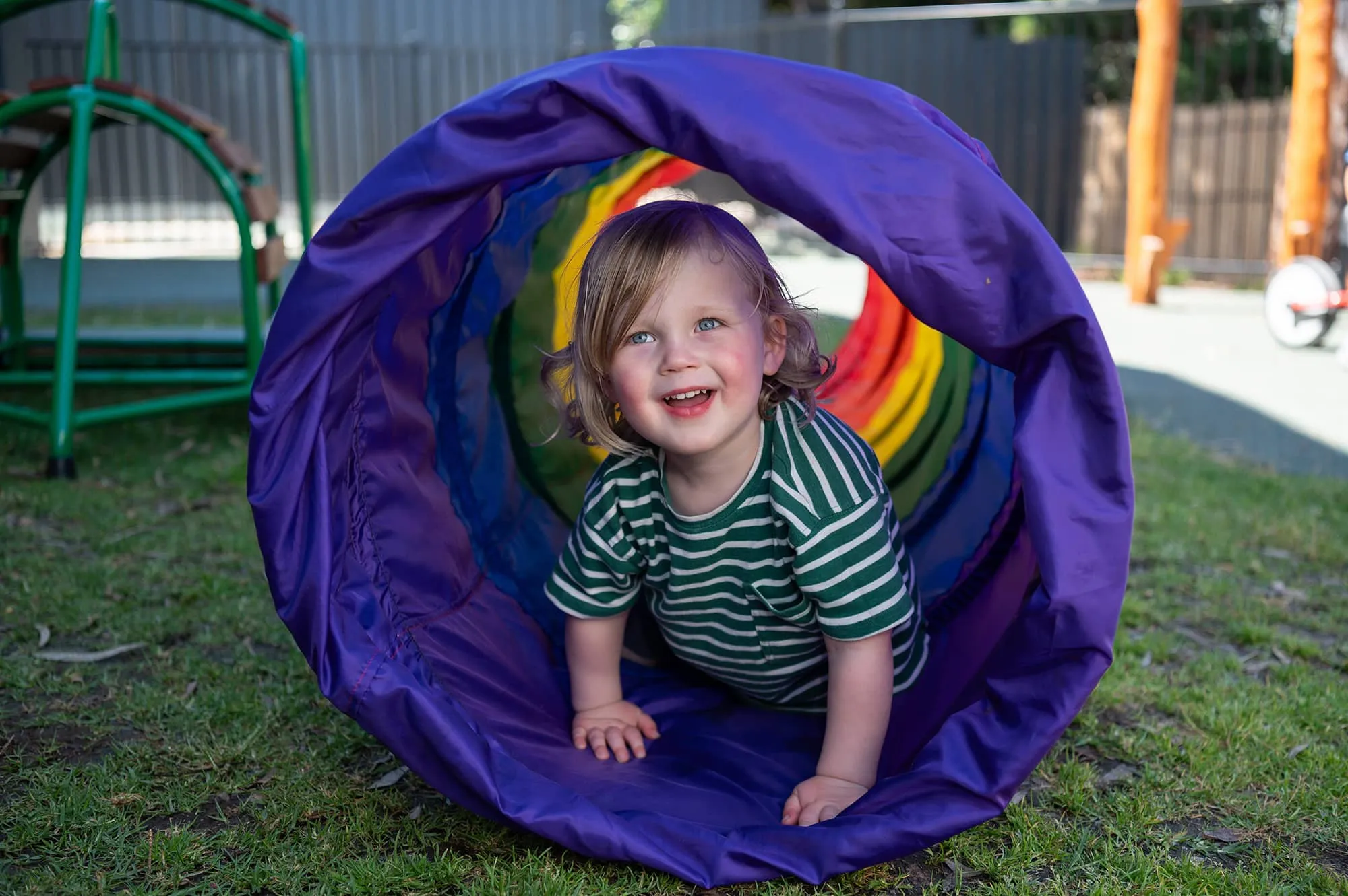 Child exploring in an outdoor environment at Beyond.